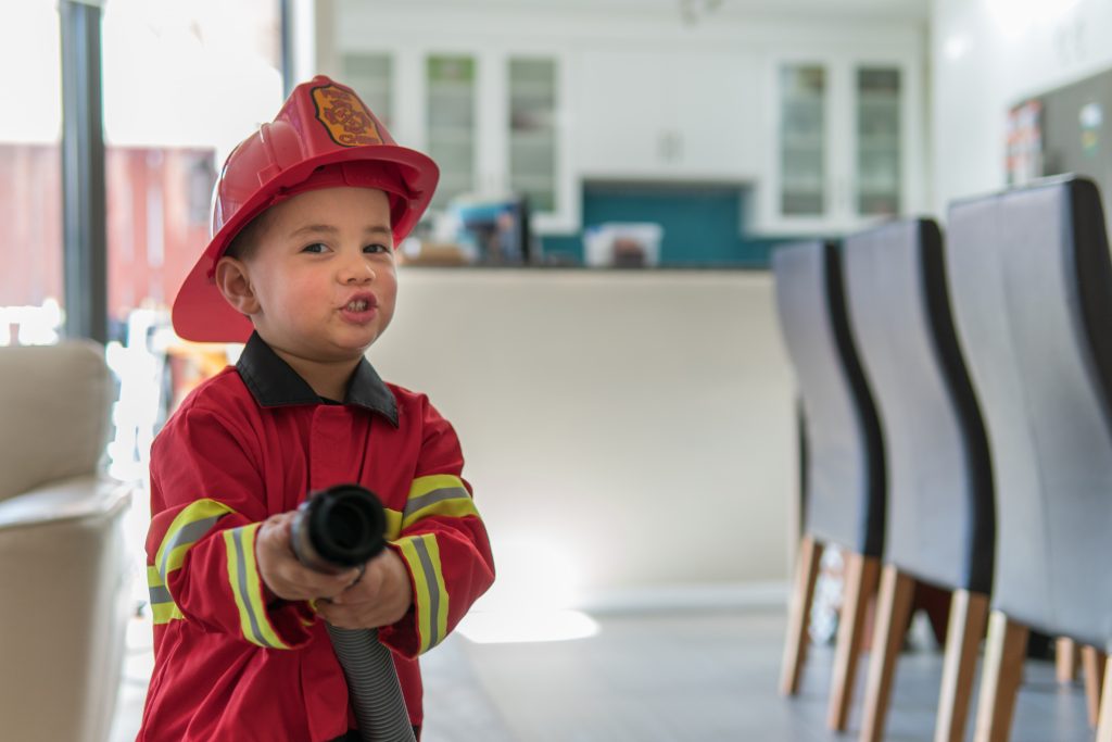 Little boy pretending to be a fireman